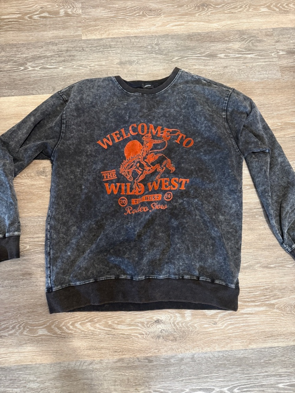Women's Washed Black Scoop-Neck Graphic Sweatshirt with Orange Rodeo Print